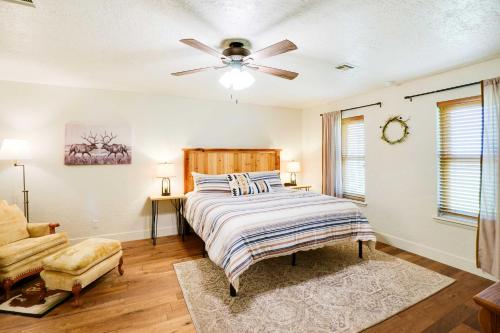 a bedroom with a bed and a ceiling fan at Spacious Country Home Near Ft Sill and Medicine Park in Lawton