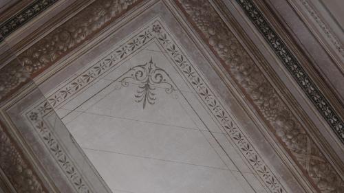 an ornate ceiling with a stenciled ceiling at Monument Hotel in Athens