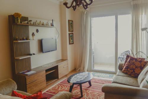 TV a/nebo společenská místnost v ubytování Apartamento Vivendas de Canela, uma quadra da Catedral