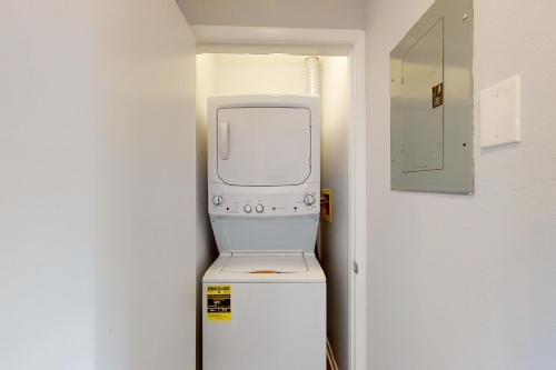 a white appliance sitting on top of a refrigerator at Sonesta 203 in Ocean City