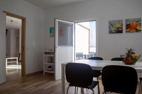 a dining room with a table and chairs at Casa La Balaustrada in Valverde