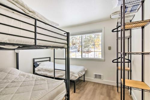 a bedroom with two bunk beds and a window at The Cottages Sweet Skiiers Escape On The Resort! in Beaver