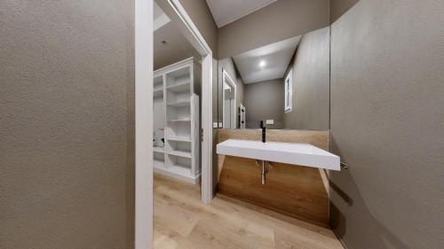 a bathroom with a white sink and a mirror at B&B Palazzina10 in Sasso Marconi