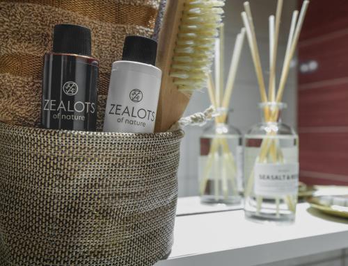 a table with two bottles of perfume on it at Maison Kalogiannis in Patitiri