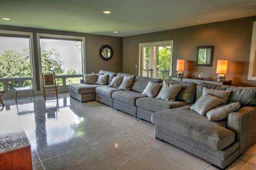 a large living room with a large couch and tables at Heavenly Manor in Boone