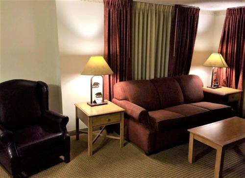 a living room with a couch and a chair at Heidelberg Inn & Resort in June Lake