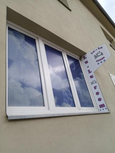 a window on the side of a house at Lu-Lu room in Požega