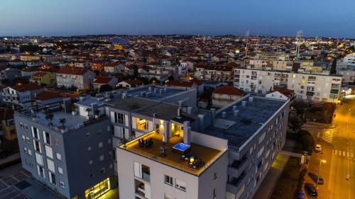 an overhead view of a city at night at Zadar Sunset Penthouse with spectacular view and jacuzzi in Zadar