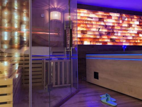 a room with a glass wall and a bowling alley at Leśna Residence & SPA in Pisz