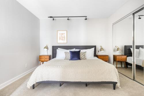 a bedroom with a bed with a blue pillow on it at Redondo Beach 1BR w Pool Gym nr Beach LAX-396 in Redondo Beach