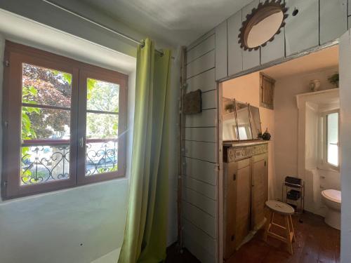 a bathroom with a shower and a toilet and a window at grande demeure d'exception in Clairvaux-les-Lacs