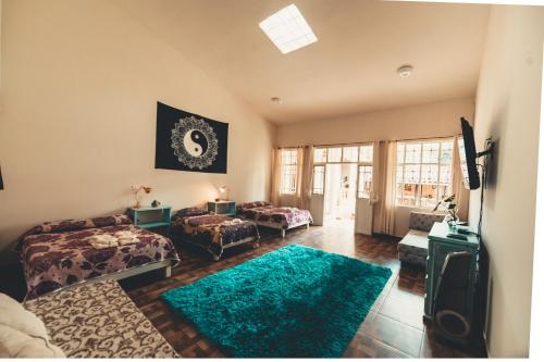 a living room with two beds and a television at Koltincalli in Xico