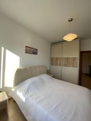 Ένα ή περισσότερα κρεβάτια σε δωμάτιο στο Tranquillity Apartament 1