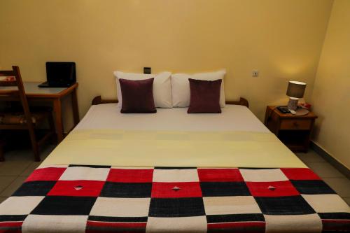 AG HOTEL Ouagaにあるベッド