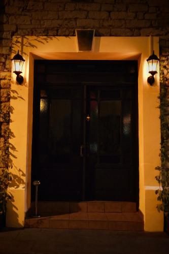 a front door of a house at night at Metropole Hotel in Limassol