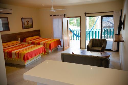 Katil atau katil-katil dalam bilik di Bungalows Oasis