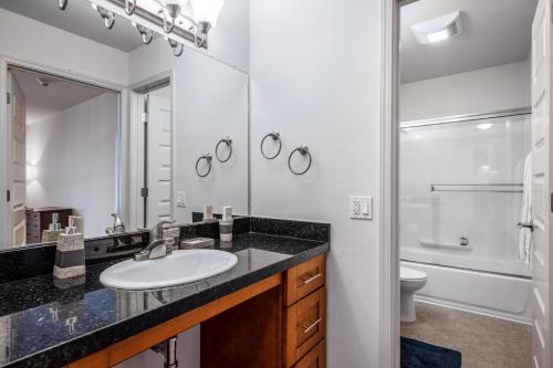 a bathroom with a sink and a shower at N Beach 1BR w Pool Fitness Center nr Muni SFO-233 in San Francisco