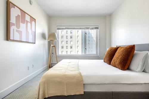 a bedroom with a large bed and a window at Nob Hill 1BR w Sauna Gym Stunning City View SFO-430 in San Francisco