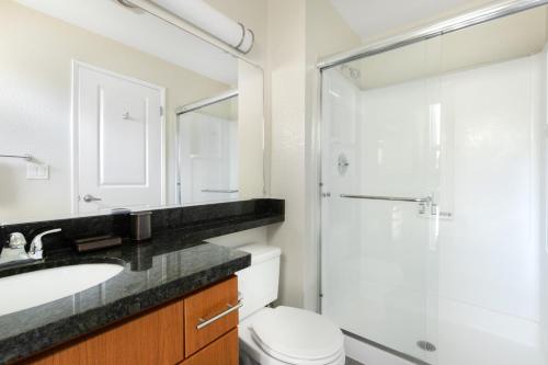 a bathroom with a sink and a shower and a toilet at Santa Clara 2BR w Parking Gym nr Groceries SFO-446 in Santa Clara
