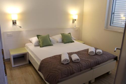 Ένα ή περισσότερα κρεβάτια σε δωμάτιο στο Apartments Lavanda