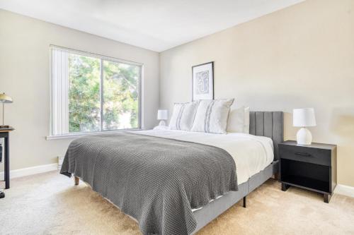 a bedroom with a large bed and a window at Santa Clara 1BR w Spa Pool AC in downtown SFO-847 in Santa Clara