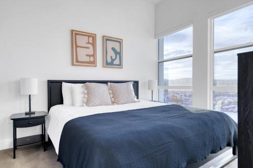 a bedroom with a large bed and two windows at Redwood City 1BR w Gym WD nr Caltrain SFO-918 in Redwood City