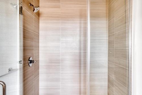 a shower with a glass door in a bathroom at Redwood City 1BR w Gym WD nr Caltrain SFO-918 in Redwood City