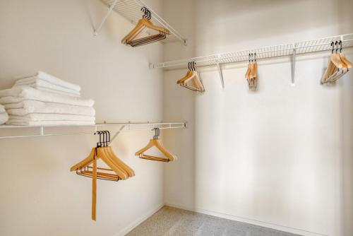 a walk in closet with towels and hangers at Fremont 2BR w Pool WD Gym nr TJ WF SFO-964 in Fremont
