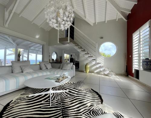 a living room with a zebraebra rug at Villa Estheria in Sainte-Anne