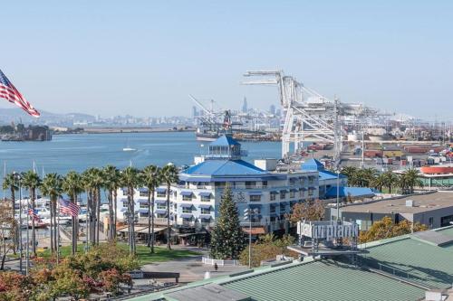 an aerial view of a harbor with a large building at Jack London square stylish luxury 1BD apartment in Oakland