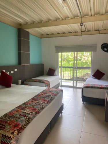 Postel nebo postele na pokoji v ubytování Villa Juana Hotel