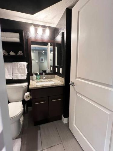 a bathroom with a toilet and a sink at Hollywood Awesome Stay Free parking in Los Angeles