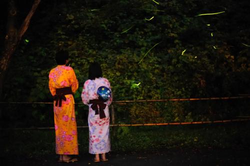 two people in kimonos standing in a field at Onogawa Onsen Kajikaso in Yonezawa