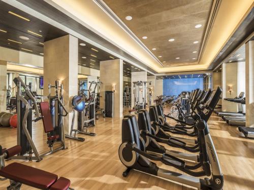 a gym with a row of treadmills and ellipticals at Four Seasons Resort Dubai at Jumeirah Beach in Dubai