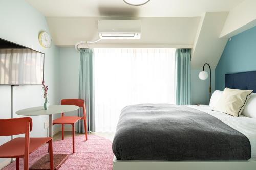 Ein Bett oder Betten in einem Zimmer der Unterkunft Section L Hamamatsucho