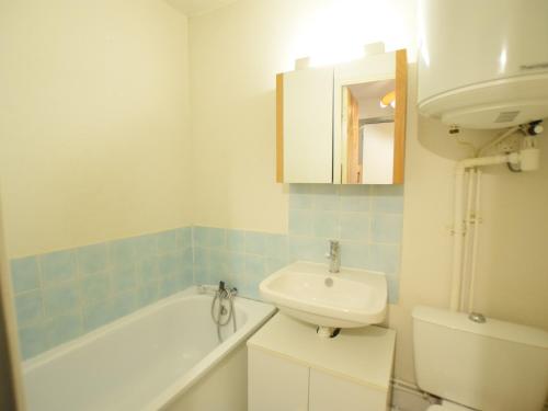 a bathroom with a sink and a bath tub and a toilet at Studio Bernex, 1 pièce, 4 personnes - FR-1-498-90 in Bernex