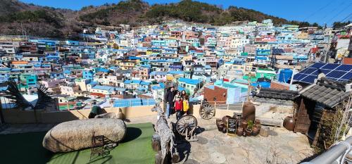 a view of a city with colorful buildings on a hill at Denbasta Central Hotel Seomyeon in Busan