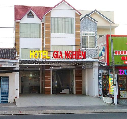 a hotel gas station with a sign in front of it at Khách sạn Gia Nghiêm in Ấp Trà Kha