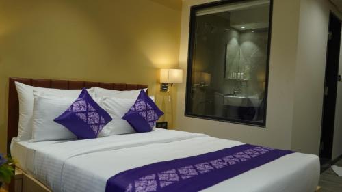Gallery image of Purple Beds by VITS Dwarkesh, Surat in Salabatpura