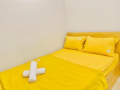 Ένα ή περισσότερα κρεβάτια σε δωμάτιο στο Milan Homestay - The Song Vung Tau Apartment