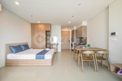 Ένα ή περισσότερα κρεβάτια σε δωμάτιο στο Milan Homestay - The Song Vung Tau Apartment