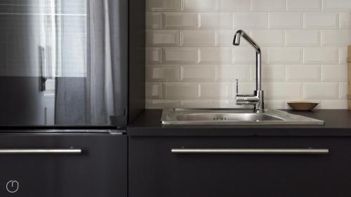 a kitchen with a sink and a shower at Italianway-Veniero in Milan