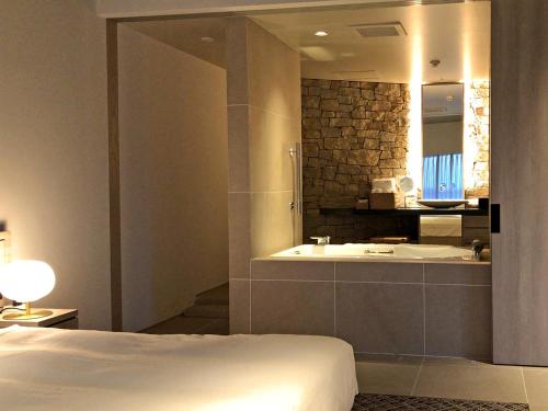 Postel nebo postele na pokoji v ubytování Hotel Anaga