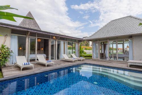 an image of a villa with a swimming pool at Casa Batu Belig in Seminyak