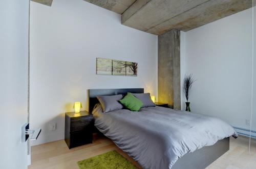 En eller flere senge i et værelse på Les Immeubles Charlevoix - Le 760605