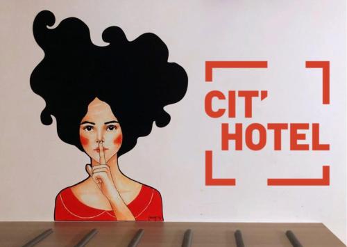 a painting of a woman with her finger in her mouth at HOTEL ARVERNA VICHY - ClT'HOTEL in Vichy