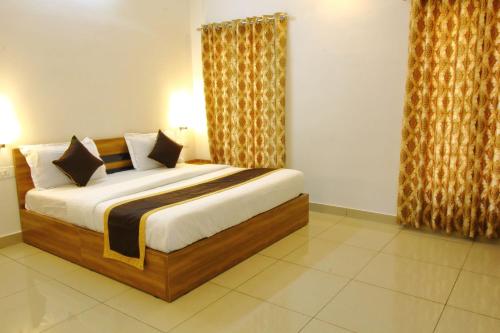 a bedroom with a large bed in a room at TreeSong Villa - Tranquil Forest Villa in Wayanad in Sultan Bathery