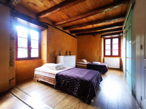 Postel nebo postele na pokoji v ubytování Gîte Les Combes Montignac Lascaux