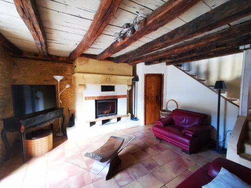 TV a/nebo společenská místnost v ubytování Gîte Les Combes Montignac Lascaux