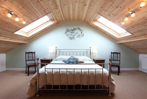 A bed or beds in a room at Dairy Barns